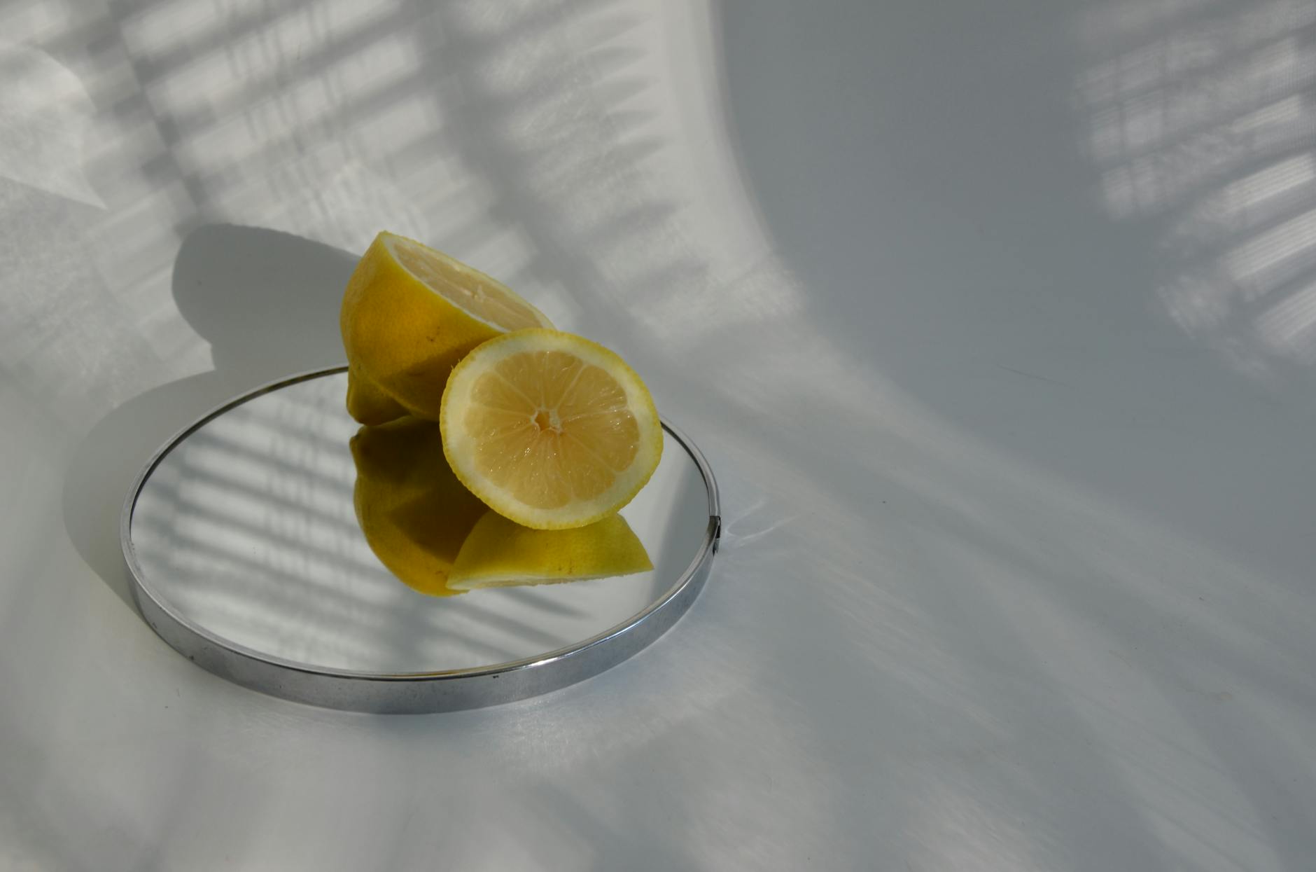 Ripe vivid lemons on a bright yellow background, symbolizing fresh starts and renewal