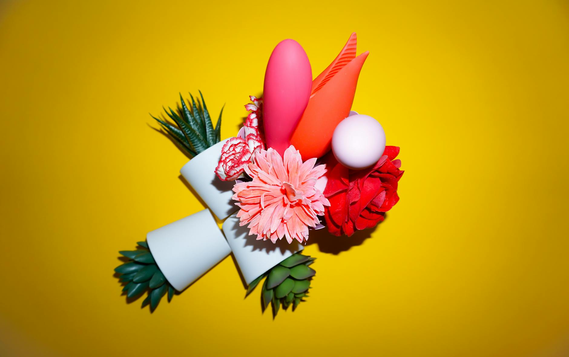 An array of vibrant adult toys including vibrators and lemon suckers in a close-up view.